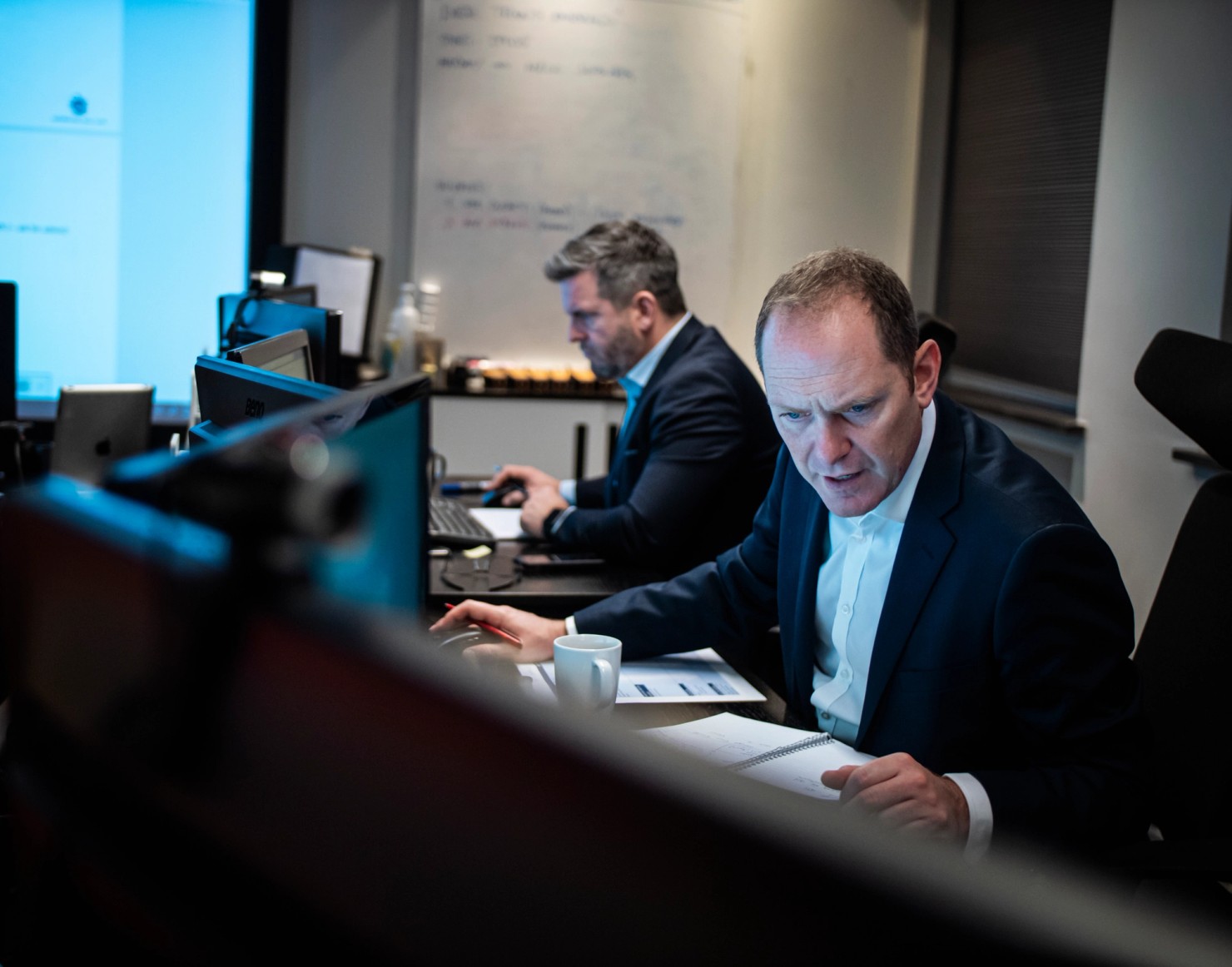 Two colleagues working in Loss Prevention Emergency Response ops room