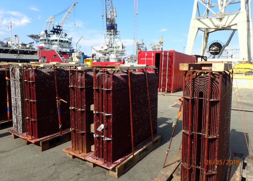 Box coolers are seen on the quayside during maintenance