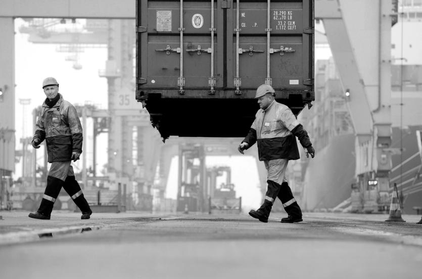 Two men in hardhats at the port of Antwerp
