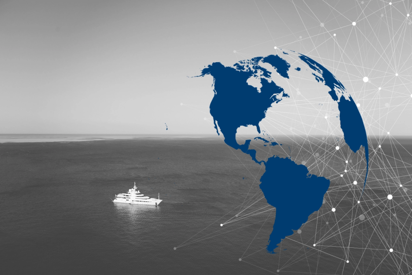 A megayacht is seen stationary at sea, with an overlay of a globe and lines signifying communication