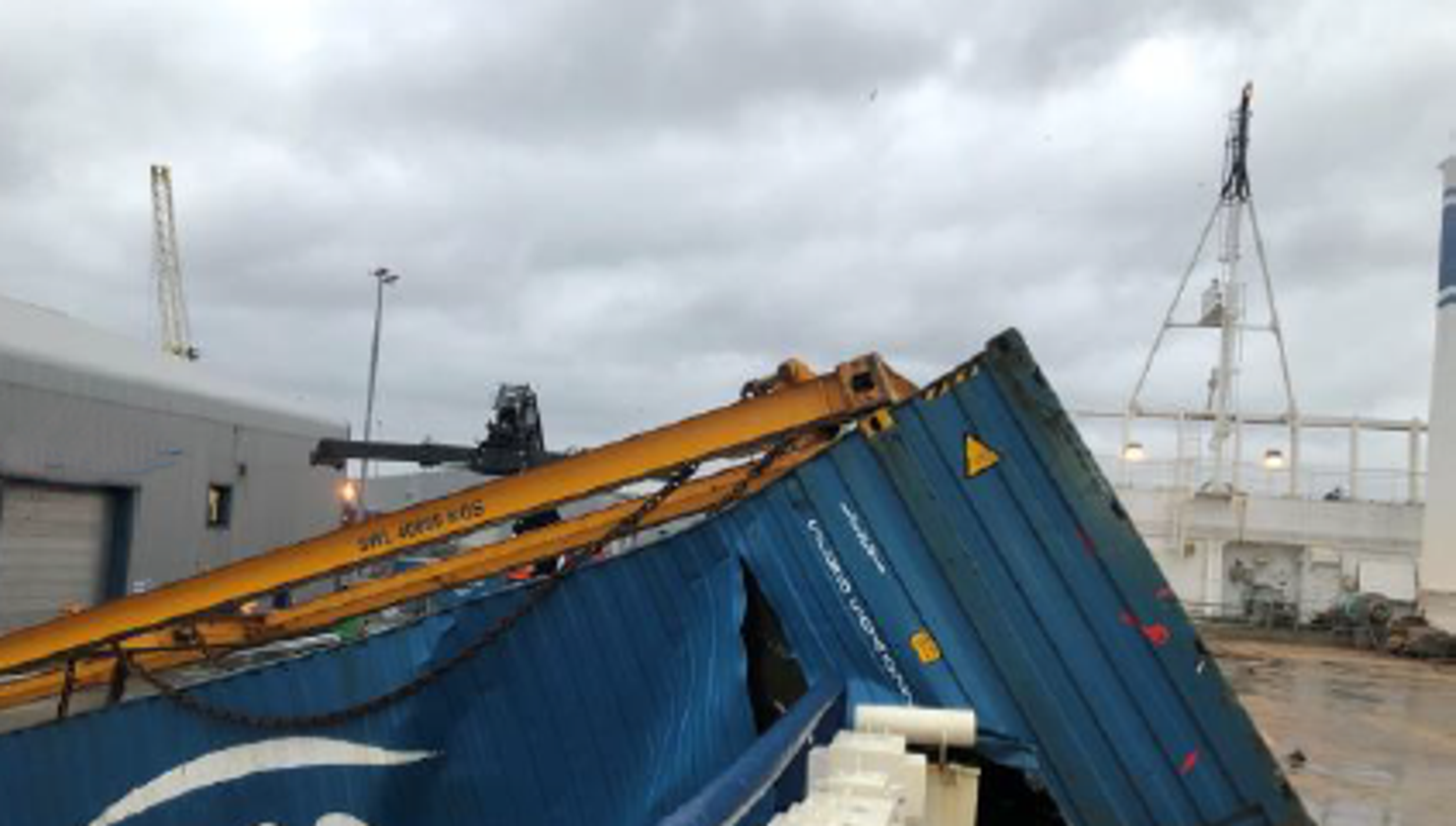 A container has been ripped open following wires breaking; the cargo inside was damaged