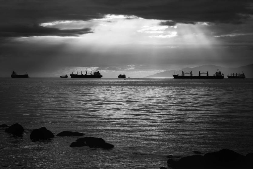 Several large vessels on the horizon