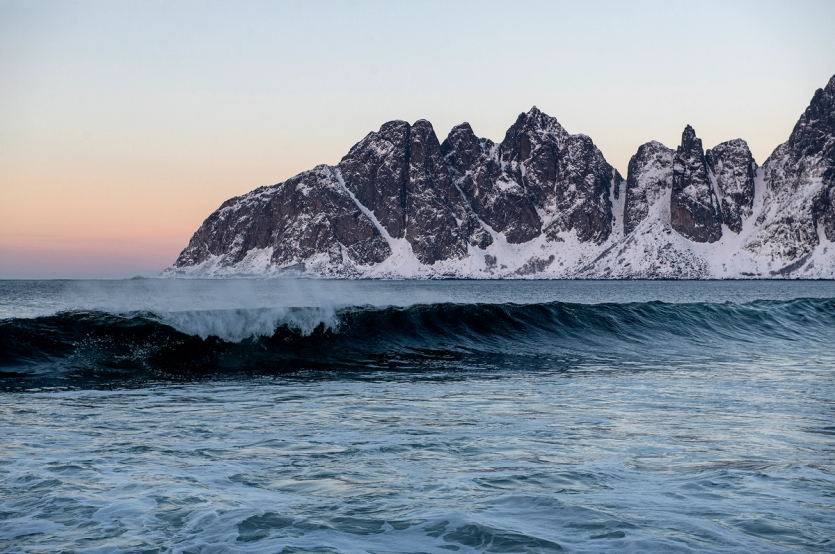 Scenic view with mountains, wave and sunrise. Senja, Norway. (Photo: Helge Skodvin)