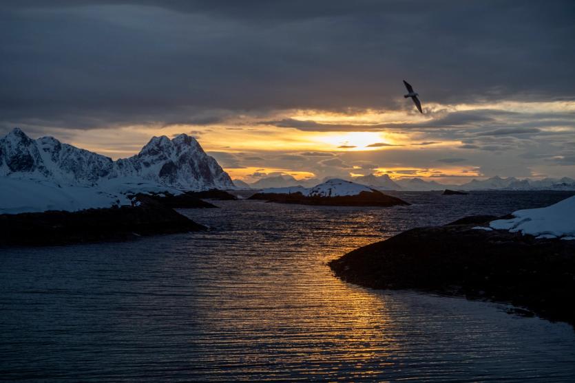 Sunset over a calm wintery ocean