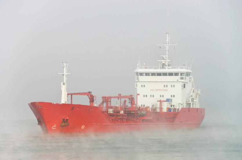 A large vessel on a misty sea