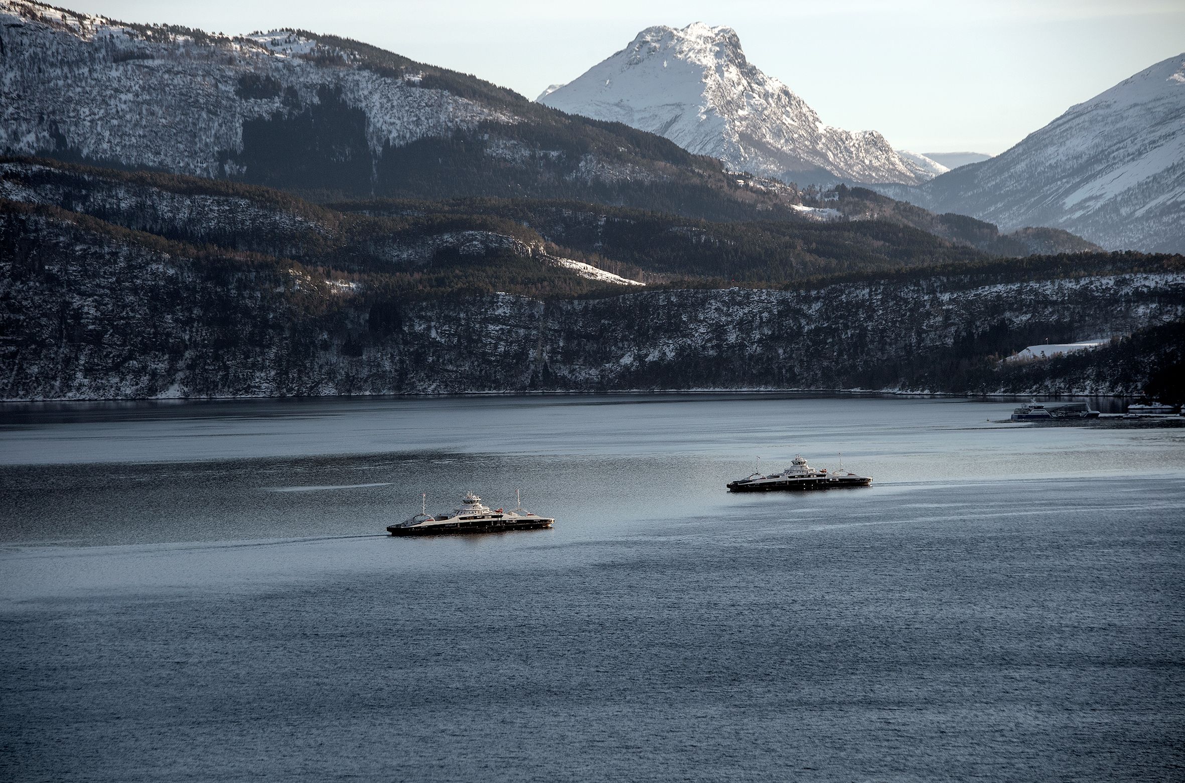 Electrical ferries in Norwegian fjord and mountain landscape