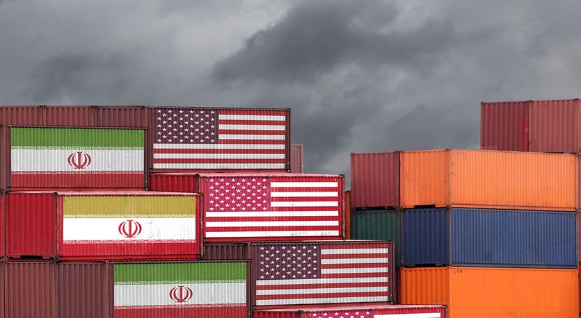 Shipper containers draped in US and Iranian flags
