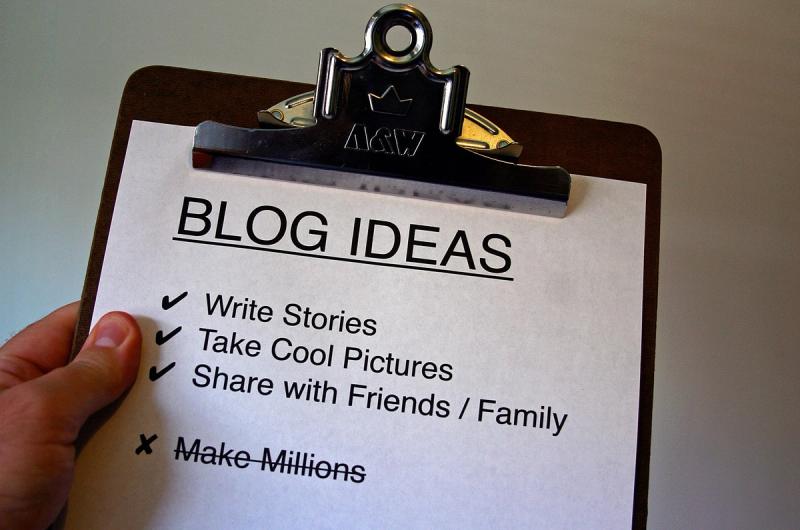 An image of a man holding a clipboard.