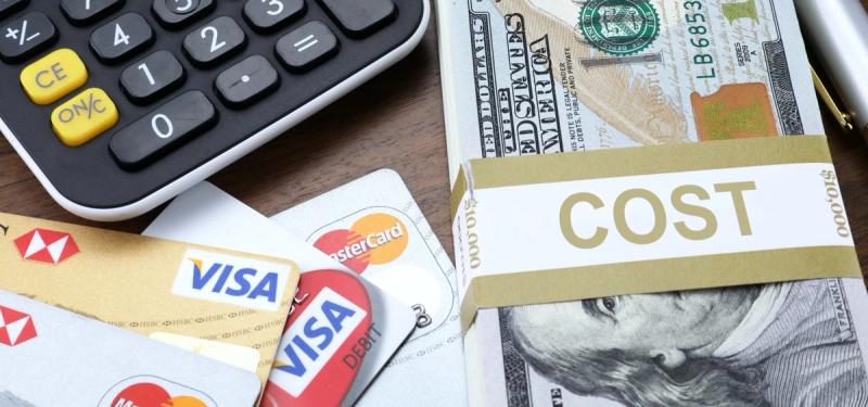 Money, calculator, and credit cards.