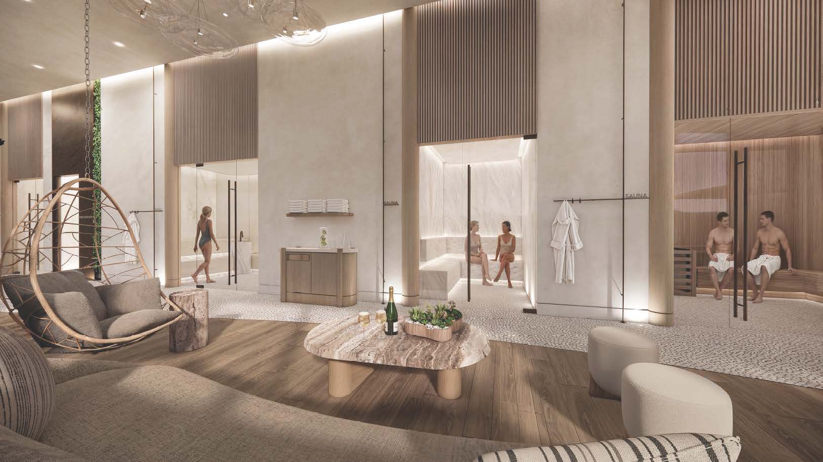 The lounge at Värra, looking through to a lit sauna where two people sit talking, with a hanging chair, a stone table set with sparkling wine, and robes on a rail.