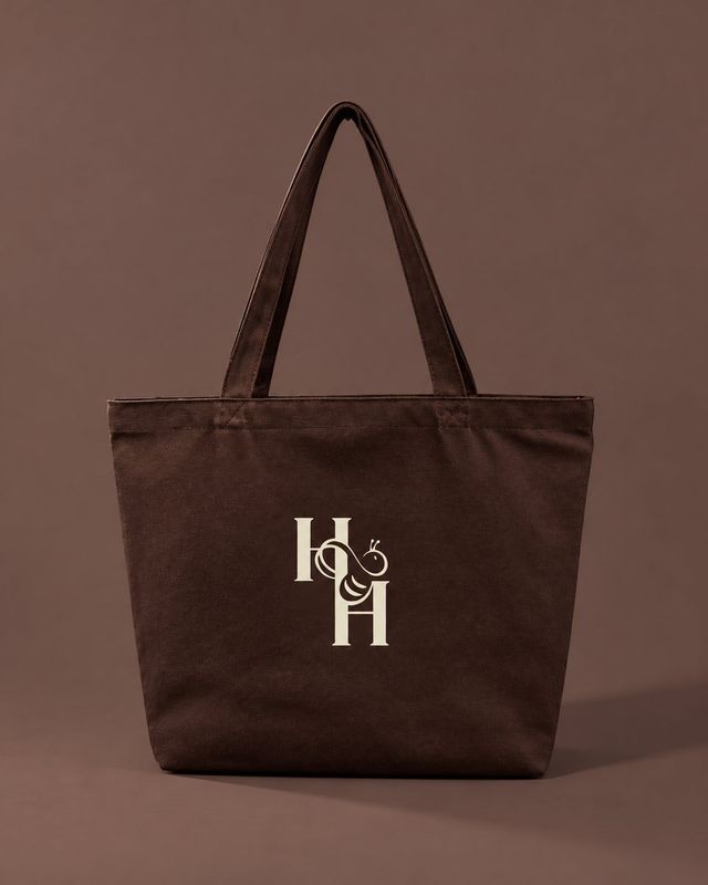 Brown canvas tote bag with the cream Honey & Haven bee monogram