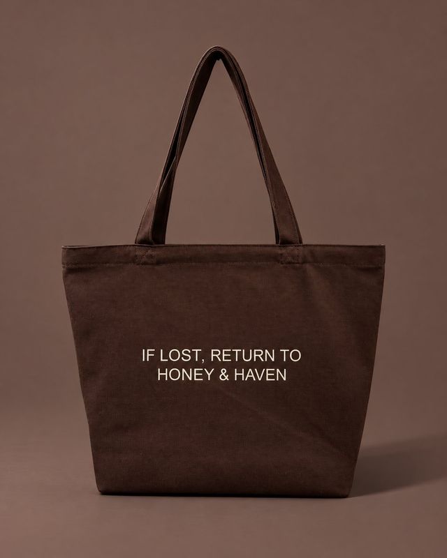 Back of the tote bag reading “If lost, return to Honey & Haven”