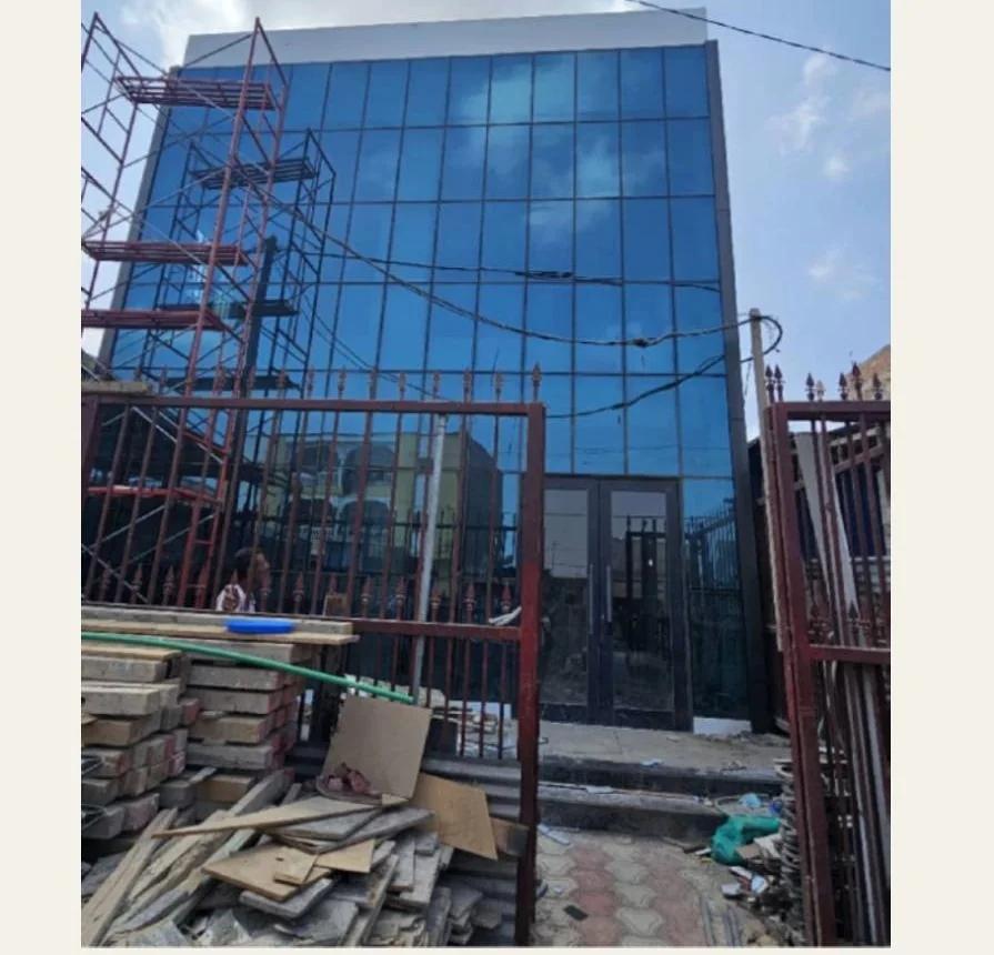 Glazed facade during construction of the CAC Bank PK12 branch