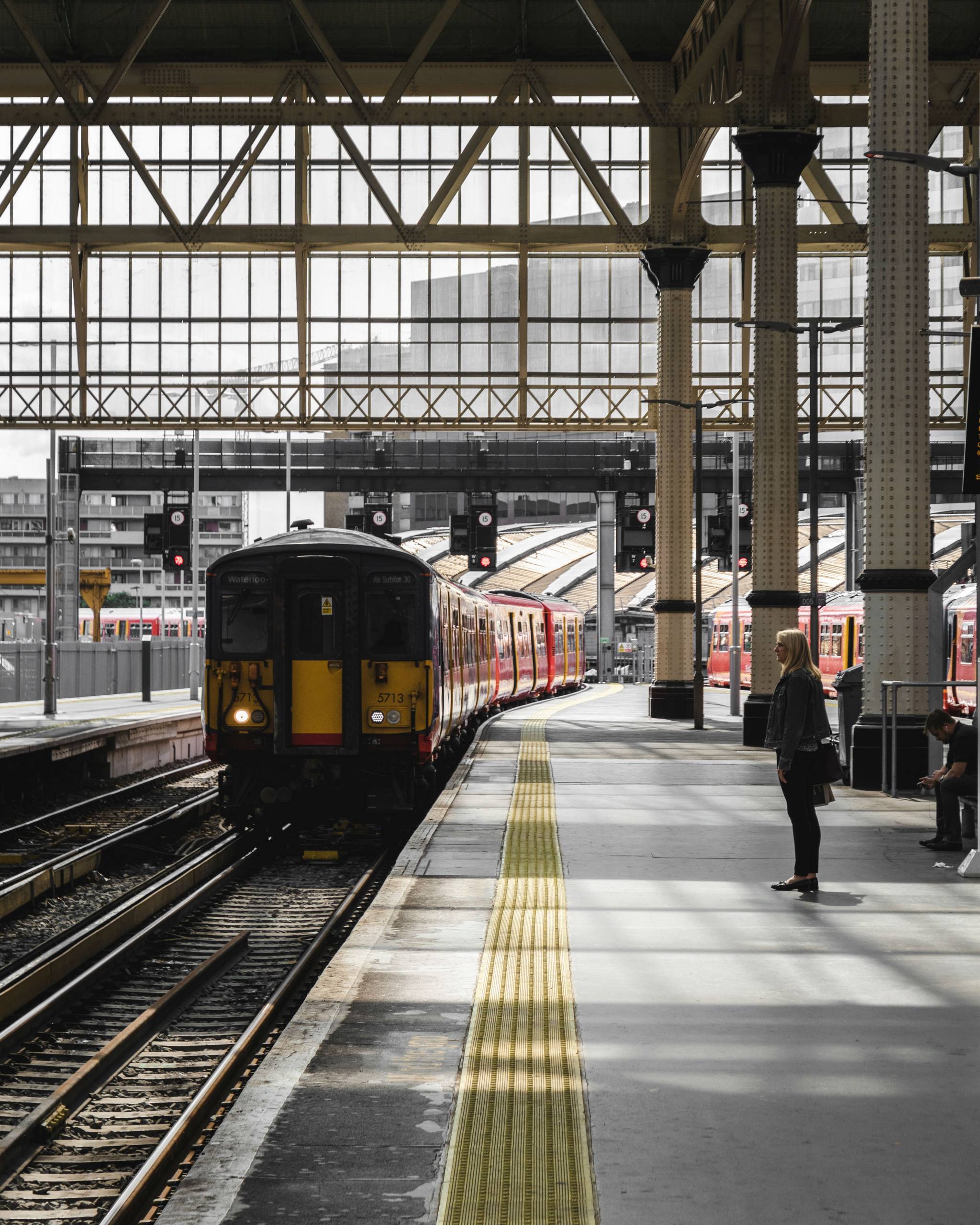 How are train stations transforming in the UK?