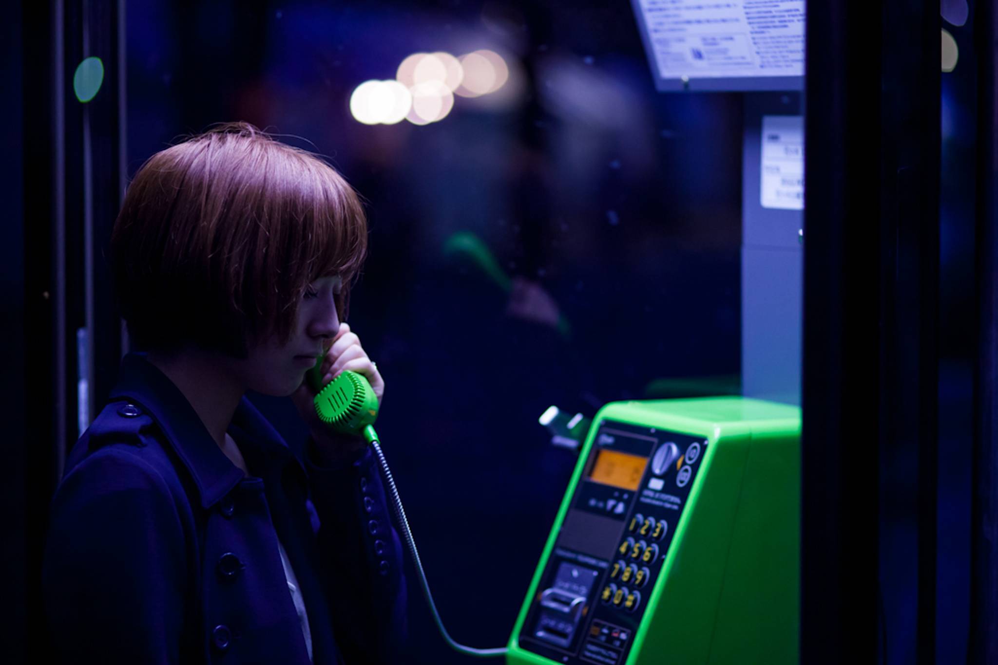 Japanese people visit phone booth to speak to the dead