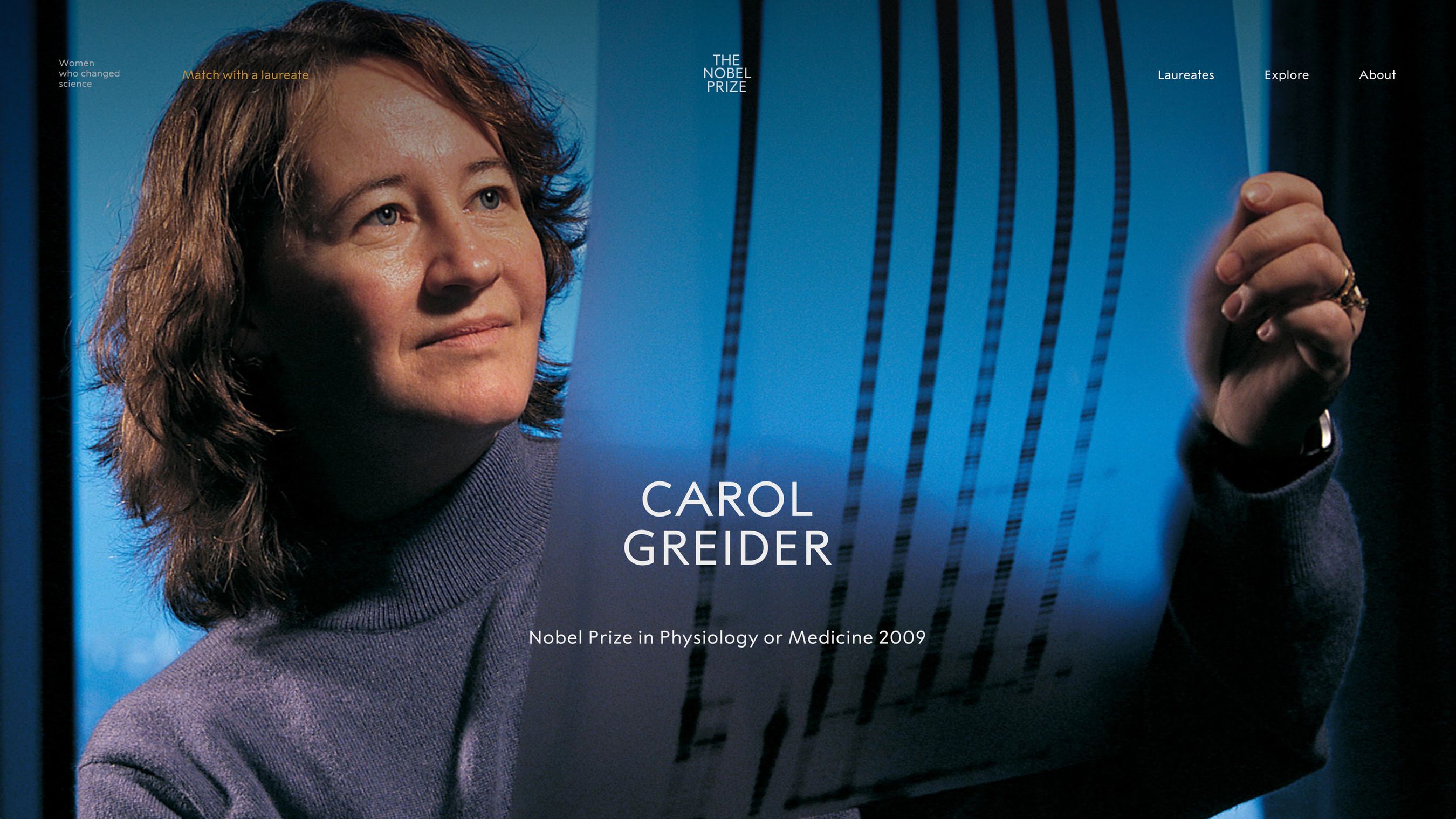A screenshot of the Nobel Prize Foundation website depicting scientist Carol Greider holding up an x-ray.