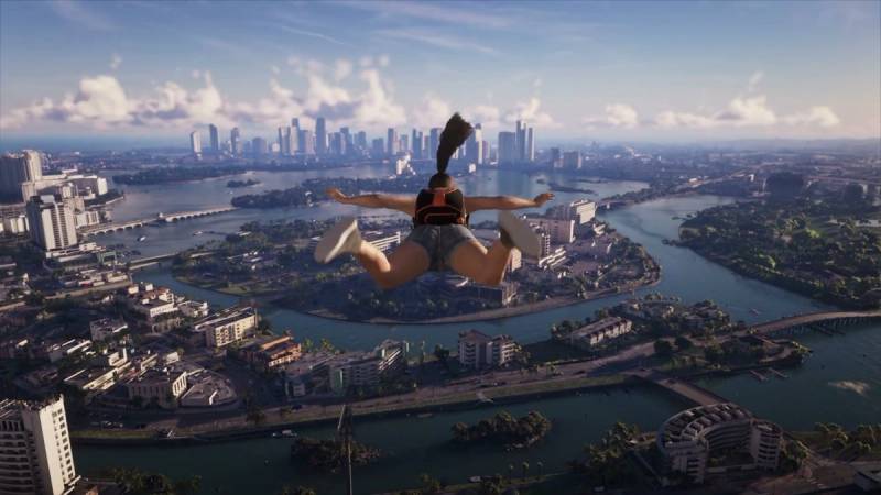 A skydiver in freefall above Vice City's islands and bridges, with the downtown skyline on the horizon.