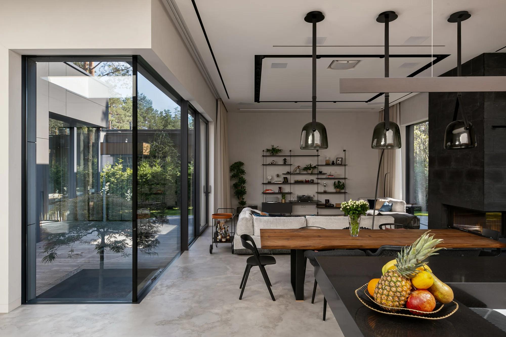 Completed open-plan residential kitchen and dining interior with large garden-facing glass doors