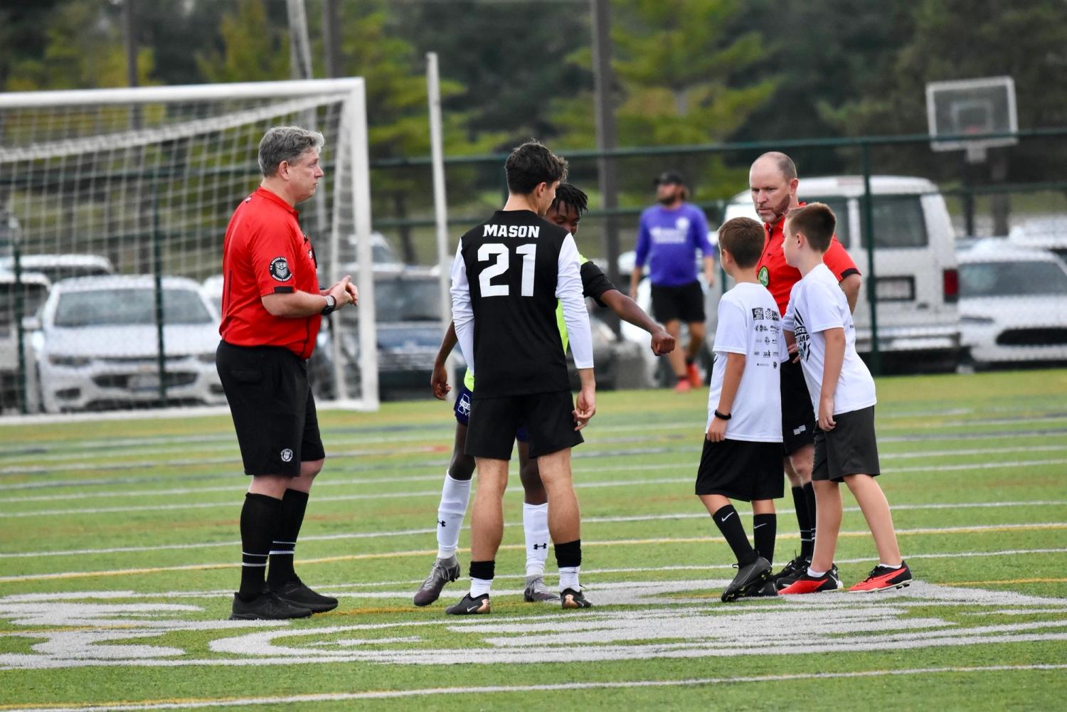 Ben and Griffin Steele with MHS varsity men's soccer team