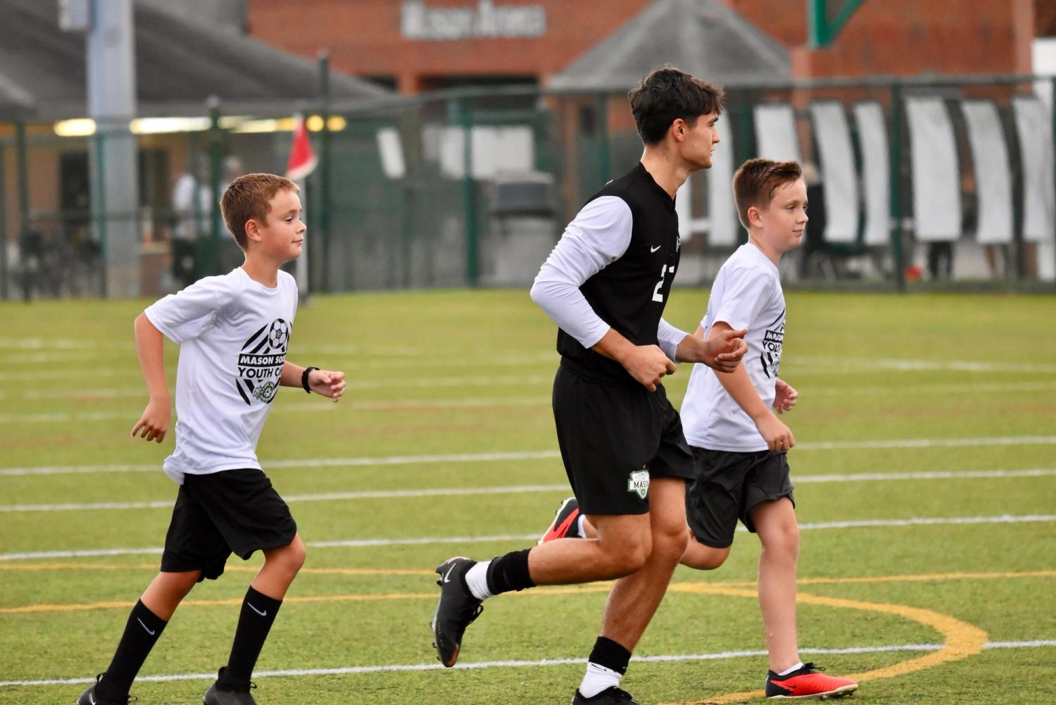 Ben and Griffin Steele with MHS varsity men's soccer team