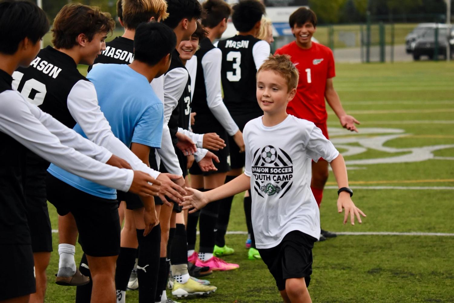 Ben and Griffin Steele with MHS varsity men's soccer team