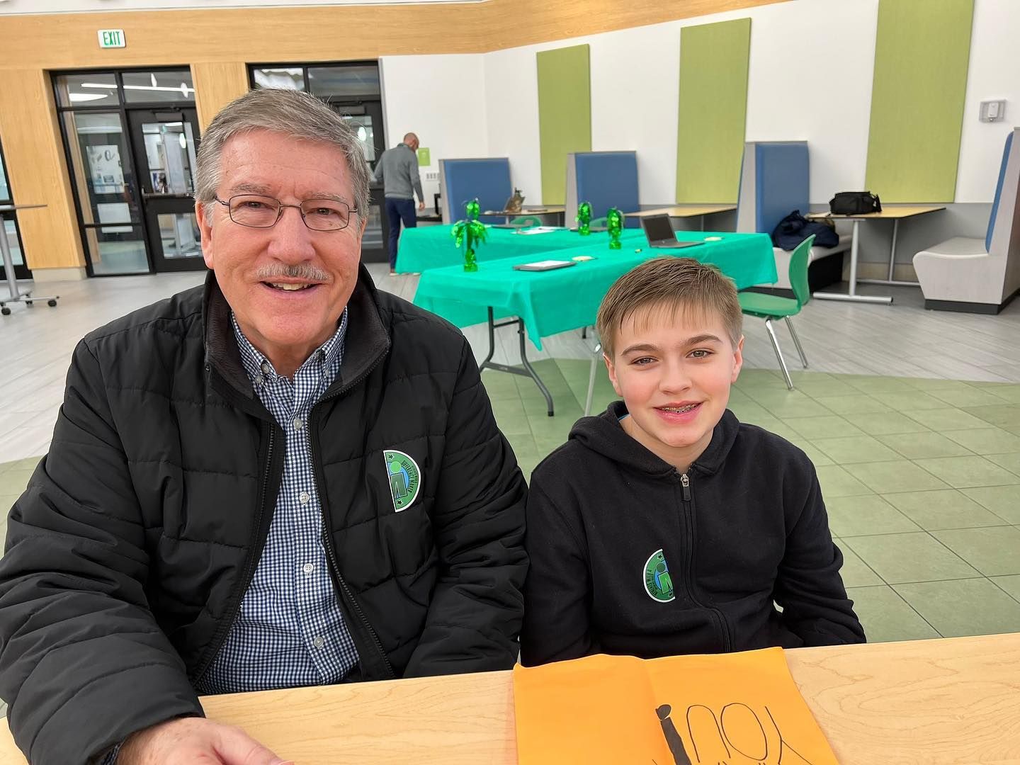 Teacher and student showcasing Difference Maker sticker