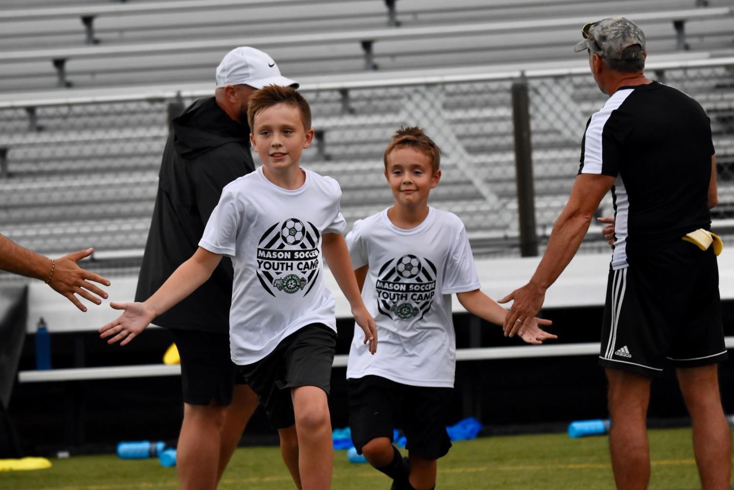 Ben and Griffin Steele with MHS varsity men's soccer team