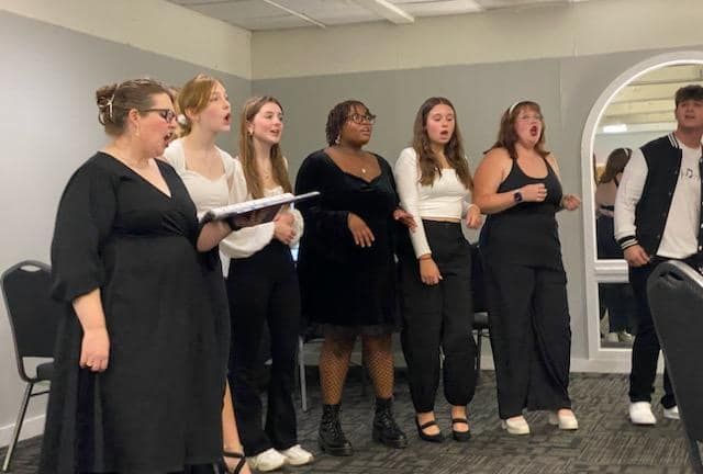 MHS Choir group singing as entertainment for the reunion