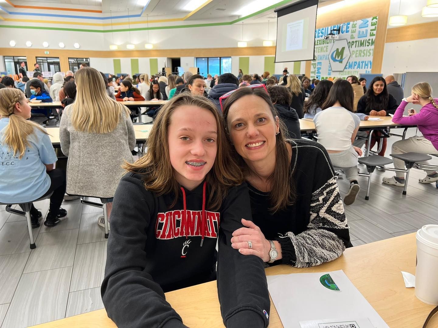 Teacher and student showcasing Difference Maker sticker