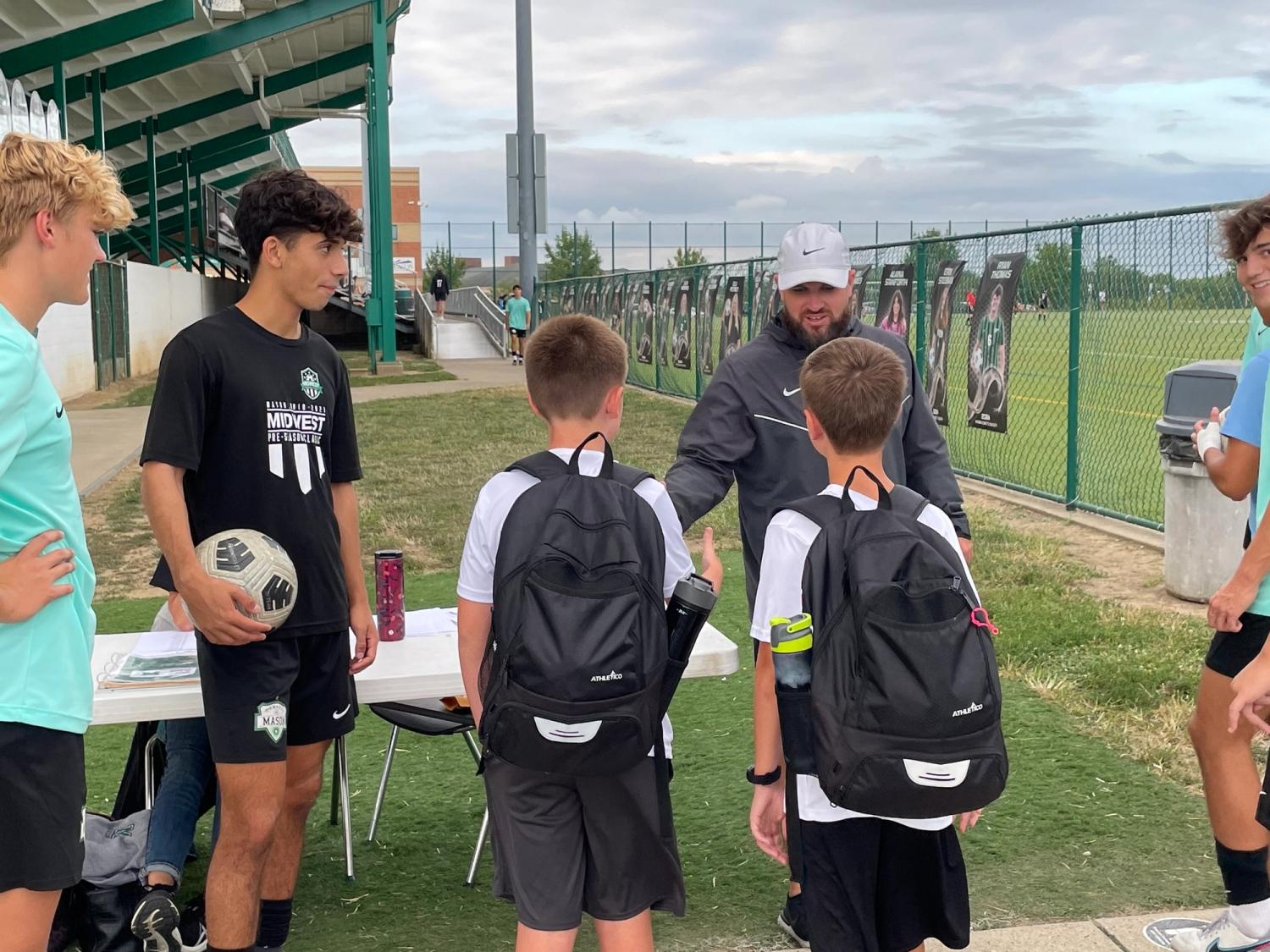 Ben and Griffin Steele with MHS varsity men's soccer team