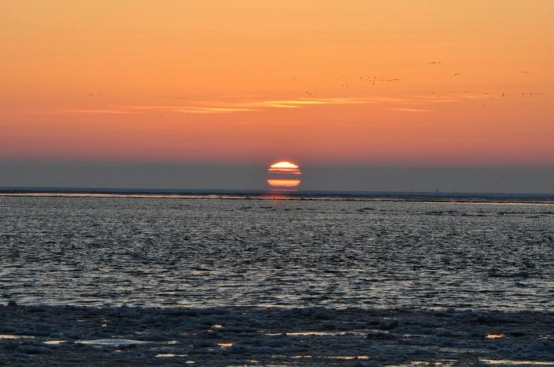 Zonsondergang boven het wad bij Vlieland