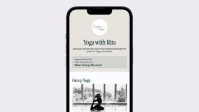 a phone with a yoga with rita app on it .