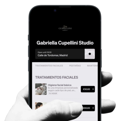 a hand is holding a cell phone with gabriella cupellini studio on the screen