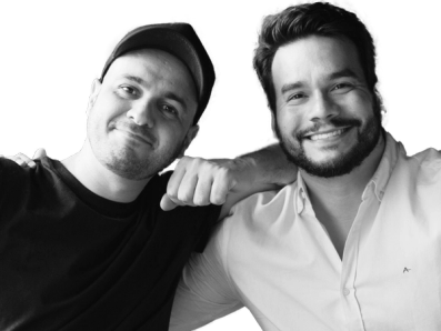 two men are posing for a picture and one has the letter a on his shirt