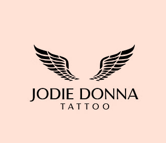 a logo for jodie donna tattoo with wings on a pink background