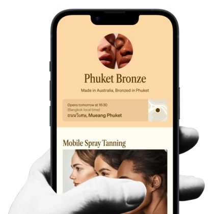 a hand holding a phone that says phuket bronze on it