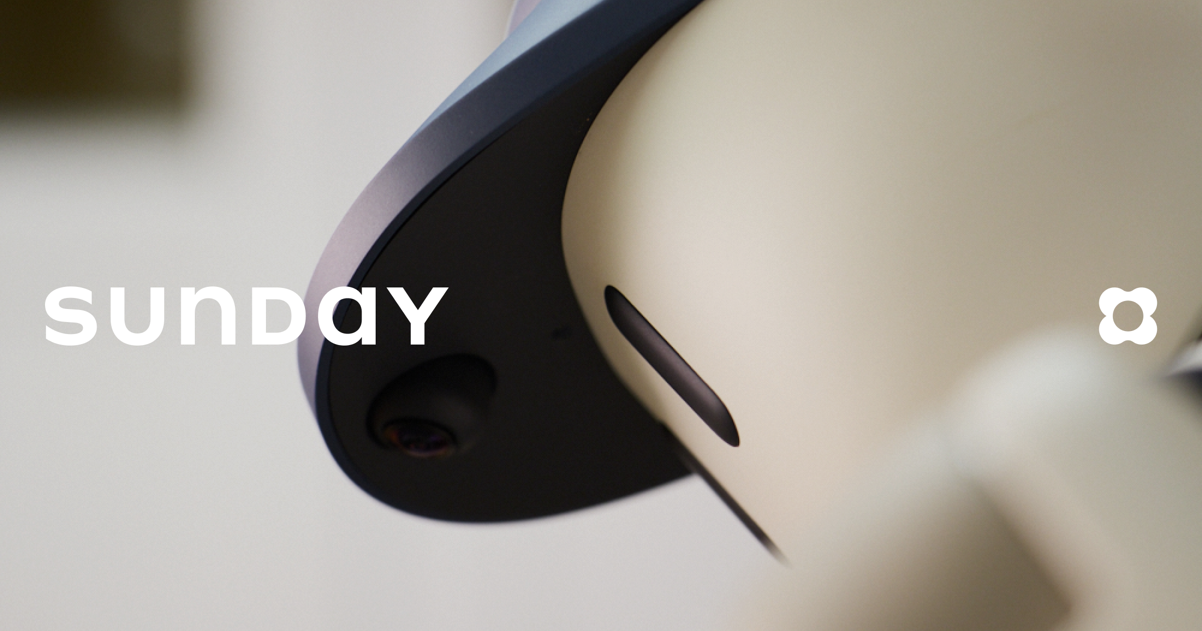 Friendly white robot with blue accents from Sunday Robotics