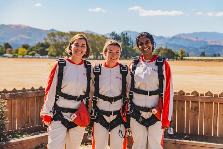 3 women smiling after skydive session in Queenstown