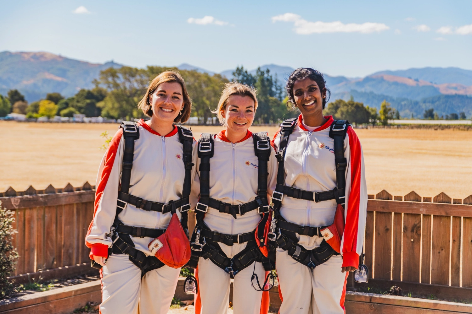 3 women smiling after skydive session in Queenstown