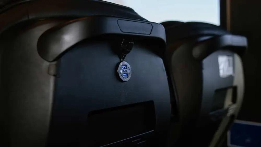 USB charger on back of a bus seat