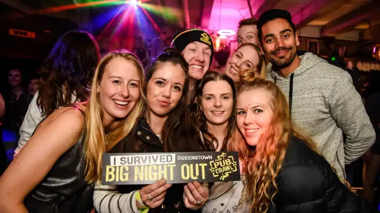 Group of people on a pub crawl in Queenstown