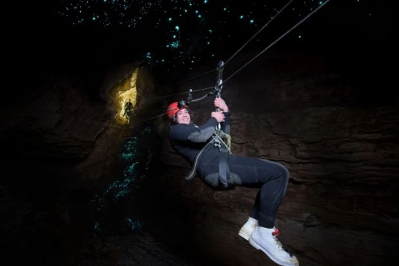 Wild Kiwi guest abseiling through glowworm caves