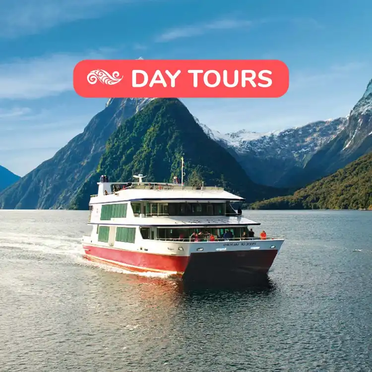 Boat crusing through Milford Sound in New Zealand