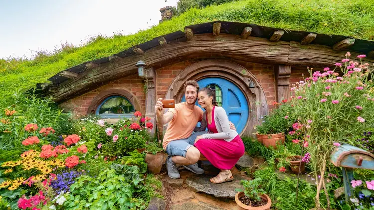 Couple take a photo together at Hobbiton
