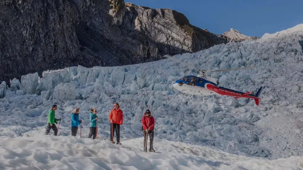 People hiking Franz Josef Glacier