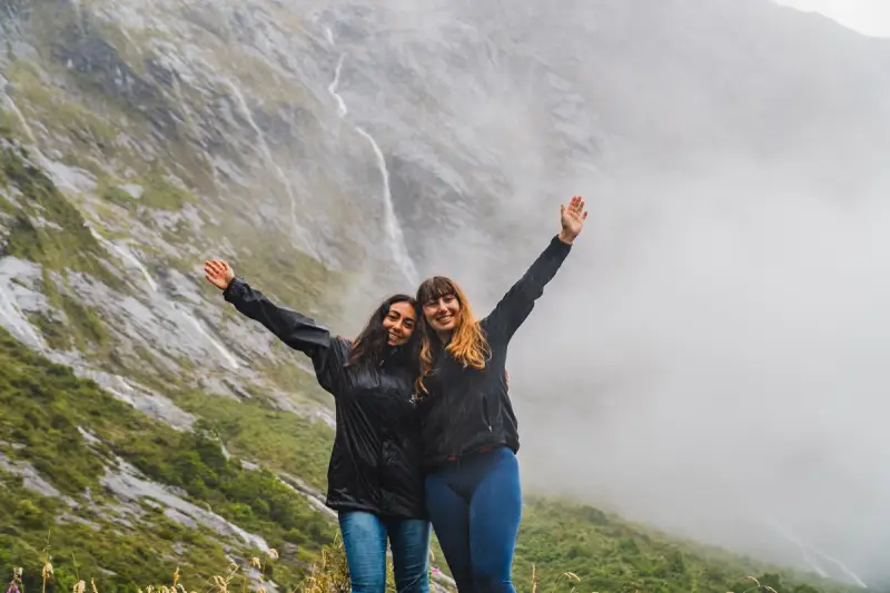 Small group tour cruising Milford Sound in summer