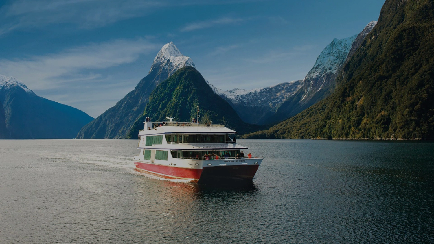 Boat cruising in Milford Sound