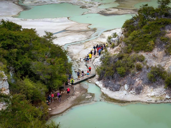 People walking through Wai-O-Tapu