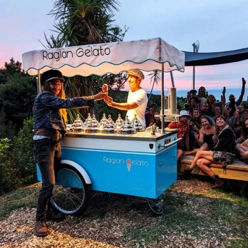 Man serving gelato from a cart