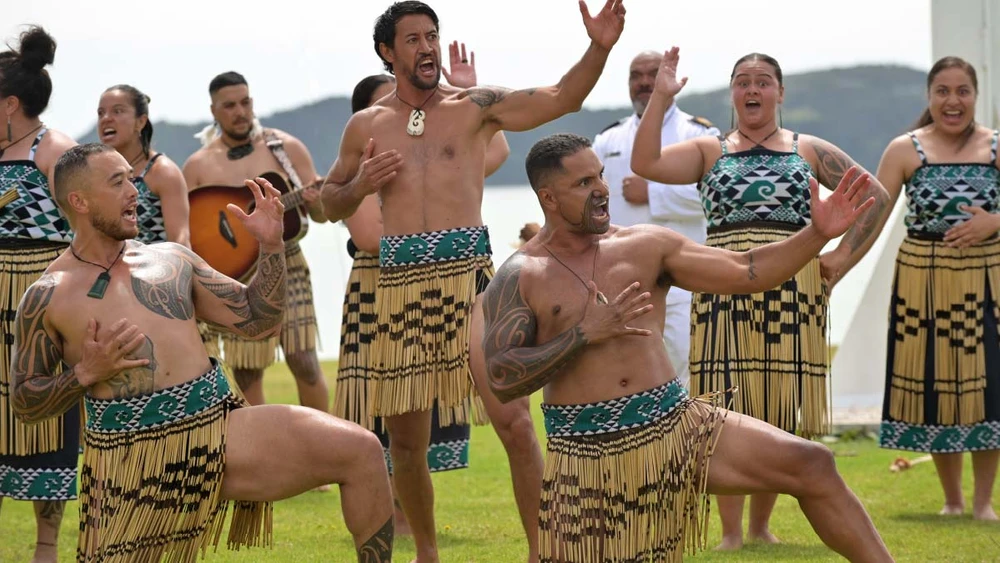 Maori people doing a traditional challenge
